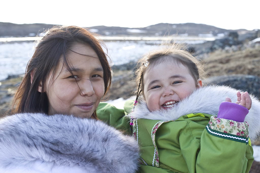 Native American Mother and Daughter posing for the camera.